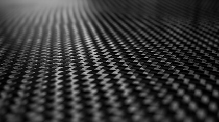 Full-frame carbon fiber weave texture in matte black finish, ideal for automotive, aerospace, and tech material backgrounds