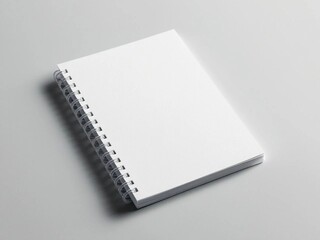 blank white spiral note book mockup on light gray background