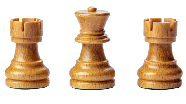 Set of wooden chess pieces featuring a rook and a king, symbolizing strategy, competition, and intellectual engagement in games.