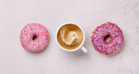 An assortment of vibrant donuts and a coffee cup perfect for a Valentines Day card