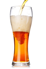 A glass of beer with a golden hue and frothy head, isolated on a clean white background