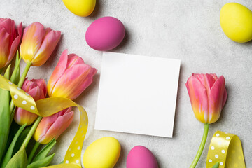 Blank square easter greeting or flyer card mockup with copy space for card design presentation, flat lay with festive decorations