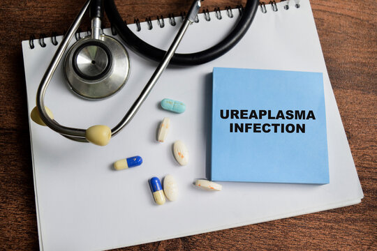 Concept of Ureaplasma Infection write on sticky notes isolated on Wooden Table.