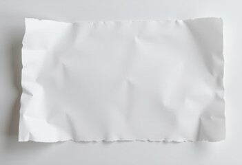 Obraz premium Crumpled white paper background for creative design projects 