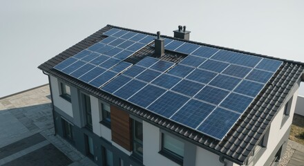 Fototapeta premium Modern solar panels on rooftop of residential home for sustainable energy solution