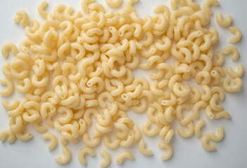 Curly pasta shapes scattered on a white background  