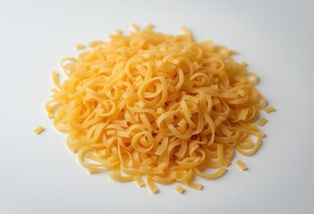 Uncooked yellow pasta swirl pile on a white background  