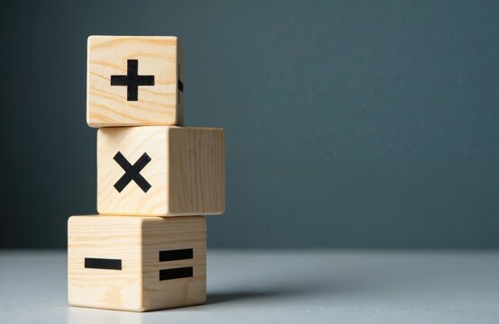 Wooden cubes with math symbols plus minus multiply divide equals. Arithmetic calculation or education concept. Mathematics operation signs for calculating or education. Learning numbers.