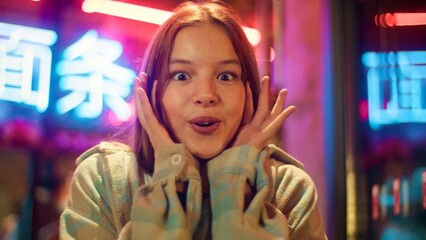 Portrait surprised Asian Caucasian daughter junior kid saying wow winning disbelief in city excited...