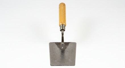 Pointing Trowel: Masonry Tool with Wooden Handle, Used for Bricklaying and Mortar Work.