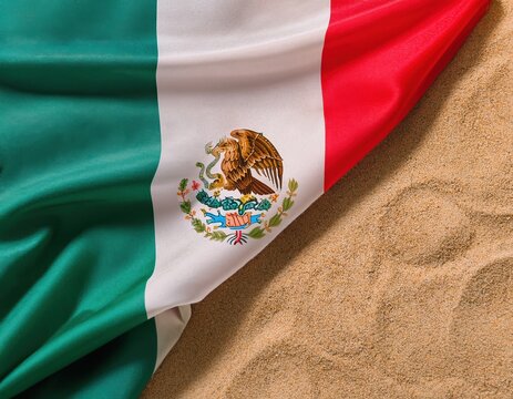Mexican flag on sandy beach - tricolor, eagle emblem, national symbol, textured fabric, vibrant colors - Powered by Adobe