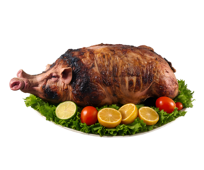 Delicious Lechon Asado, A Slow-Roasted Whole Pig Delicacy Served on a Bed of Fresh Lettuce with Zesty Lemon and Lime Slices and Vibrant Red Tomatoes Displayed on a White Plate