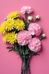 A fresh bouquet of various flowers arranged on a light pink background