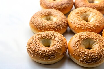 sesame seed bagels in white background