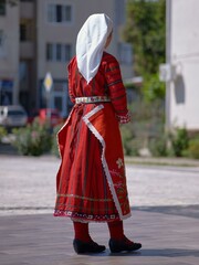 Bulgarian Woman in Traditional Folk Costume Outdoors