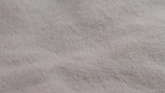  White light gray linen fabric, textile, material, close-up, macro. Textile factory. High quality 4k footage