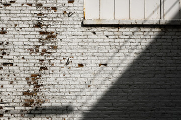 aged urban brick wall background with shadow