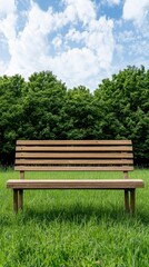 Fototapeta premium A rustic wooden park bench sits invitingly on a vibrant green lawn under a partly cloudy blue sky with lush green trees in the background providing a tranquil serene setting.