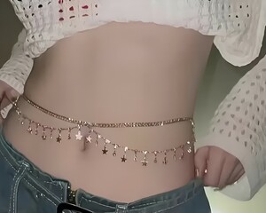 female wearing golden chain around waist