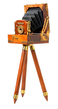 Vintage wooden folding camera on tripod capturing memories