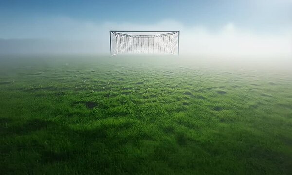 Misty soccer field with goal