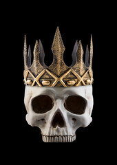 Human skull with ancient golden crown isolated on black background