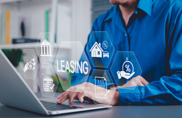 Leasing and Financial Service Concept. Businessman using laptop with icons related to leasing, finance, housing, automotive, interest rates, and monthly payments. lease agreement, leasing car,