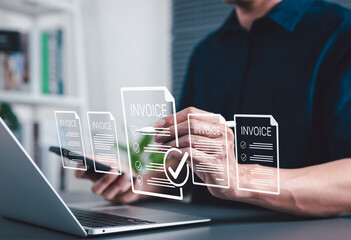Digital E-Invoice and Billing Management Concept. Businessman using laptop and pen with invoice...