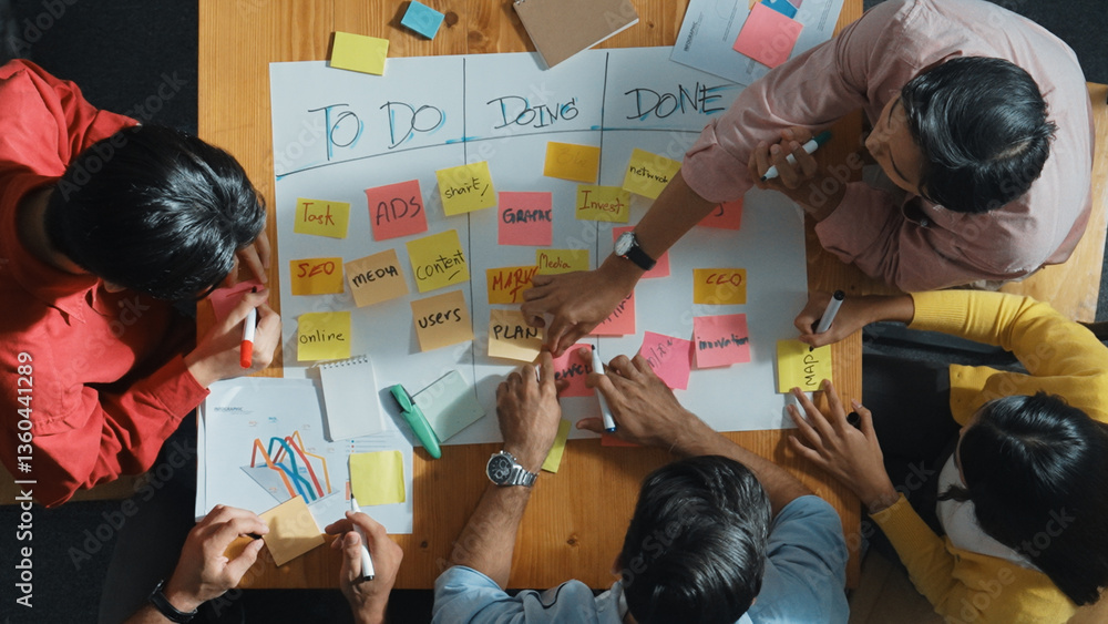Poster top view of people writing and making scrum task board while writing marketing and planning strategy