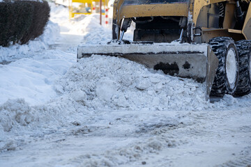 Snow Removal Equipment Actively Clearing Street Amid Harsh Winter Weather Conditions Today