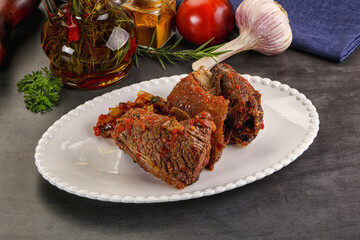 Baked beef ribs with vegetables