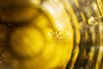 Gold Oil bubbles. circles of orange water macro. abstract yellow background
