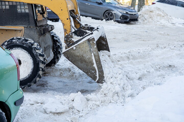 Snow Removal Equipment is Actively Working on a Beautifully Wintery Day, Clearing Paths and Roads