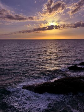 Sea waves and sunset sky at evening.