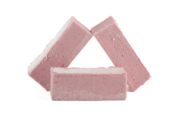 Sweet cranberry pastille bars with powdered sugar isolated on white background.