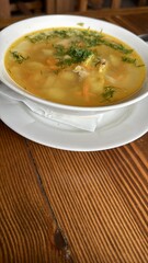 Indulge in a Delicious Bowl of Hearty Soup Made with Fresh, HighQuality Ingredients. A warm and flavorful bowl of delicious soup, packed with vibrant, fresh vegetables and rich, nutritious broth