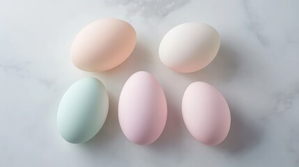 Colorful eggs arranged on a marble surface, showcasing soft pastel shades in a serene composition for spring decorations and celebrations