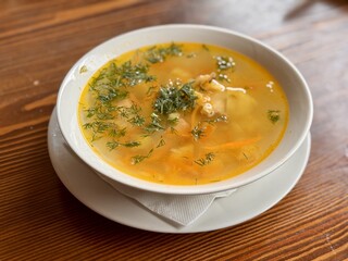 A Delicious Bowl of Clear Soup, Richly Flavored with Fresh Herbs and Colorful Vegetables. This is...