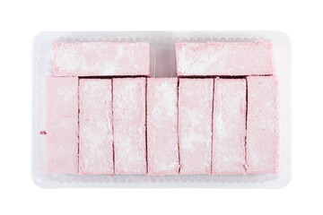 Top view of cranberry marshmallow sticks in plastic container on white background.