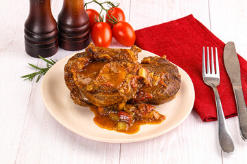 Italian cuisine - ossobuco with sauce