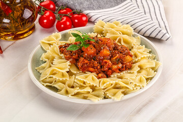 Italian pasta Farfalle Bolognese with meat