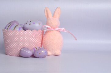 Easter Bunny and Purple Eggs. Purple background. Easter.