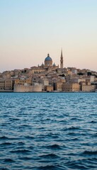 Scenic View of Coastal City with Historical Architecture at Sunset