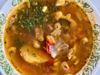 Indulge in a Delicious Bowl of Hearty Soup Made with Fresh, HighQuality Ingredients. A warm and flavorful bowl of delicious soup, packed with vibrant, fresh vegetables and rich, nutritious broth