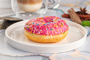 Sweet donut with strawberry icing