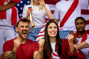 American football, soccer fans cheering at the stadium with flags and other equipment © Mediteraneo