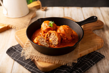 Meatballs in red chipotle chili and tomato sauce, ground pork or beef stuffed with cheese. A very popular homemade food recipe in Mexico and other countries, commonly served with rice.