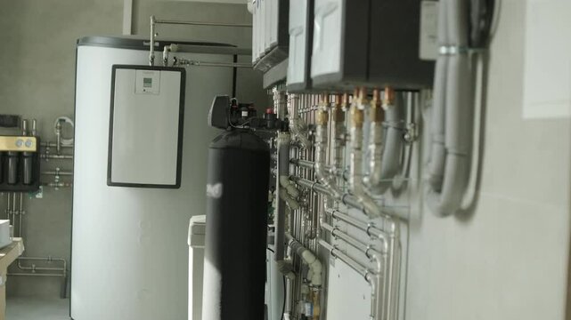 Modern residential boiler room with heating and water treatment systems