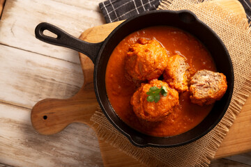 Meatballs in red chipotle chili and tomato sauce, ground pork or beef stuffed with cheese. A very popular homemade food recipe in Mexico and other countries, commonly served with rice.