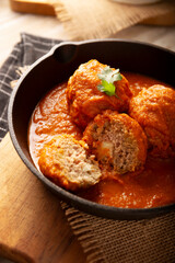 Meatballs in red chipotle chili and tomato sauce, ground pork or beef stuffed with cheese. A very popular homemade food recipe in Mexico and other countries, commonly served with rice.